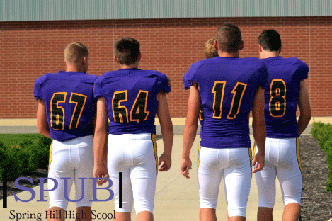 Varsity Football team members gear up for their first game of the season. They had been training vigorously, and were ready to start the season (photo by A.Davis).
