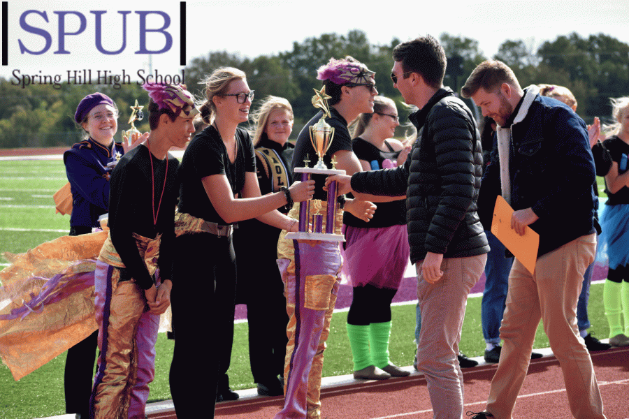 The Spring Hill Marching Broncos were announced as the first place winners of the Spring Hill Marching Festival.  Makayla Popovich, Field director  11, accepts the first place trophy with Alex Claerhout, Field director, 11, and Gus Oppeau, Field director, 10 (Photo by KOaks) 