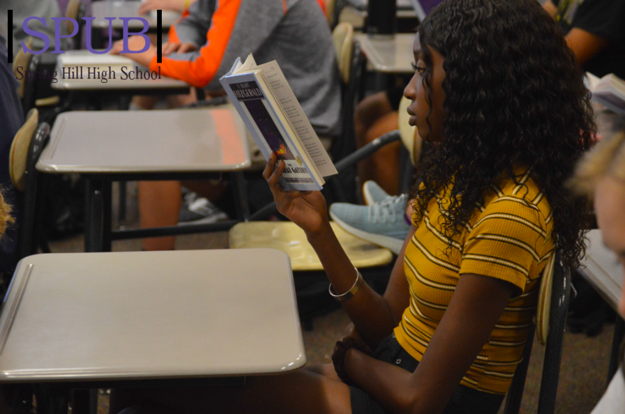 On Oct. 1 during 4th hour, Kadija Ceesay, 11, listens as Kelly Ediger, english teacher, reads The Great Gatsby. Juniors have been reading The Great Gatsby for years (Photo by HSmith).
