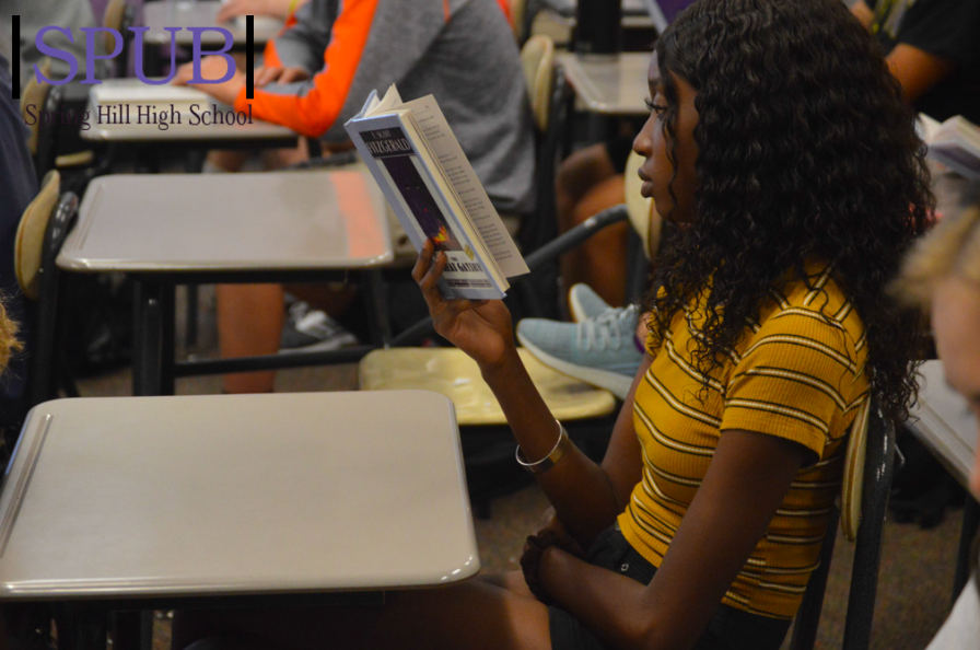 On Oct. 1 during 4th hour, Kadija Ceesay, 11, listens as Kelly Ediger, english teacher, reads "The Great Gatsby." Juniors have been reading "The Great Gatsby" for years (Photo by HSmith).