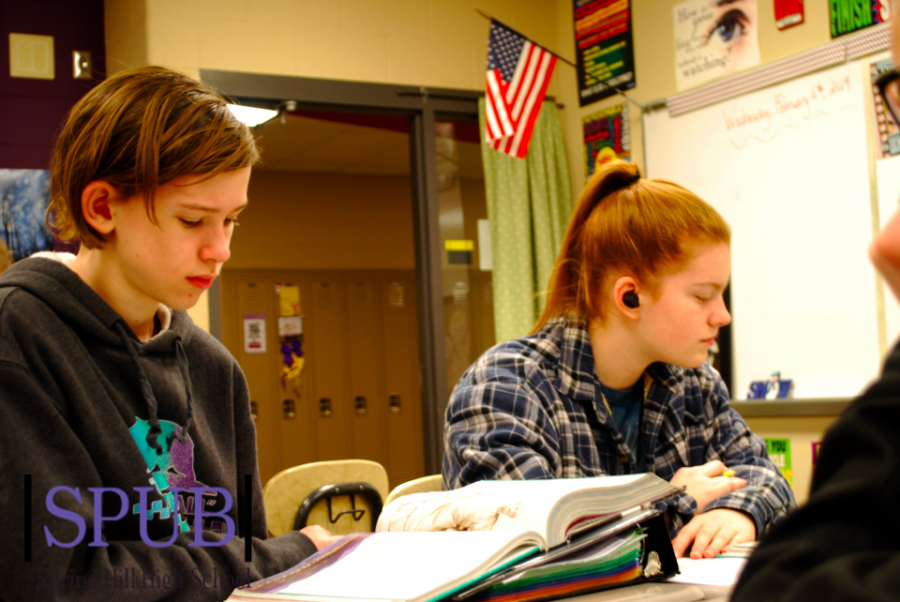 On Feb. 4, Zach Bradshaw, 10, and Cheyenne Kanakares, 10, prepare to read the Odyssey. Cheyenne also works at the Sonic. (photo credit T. Dent)