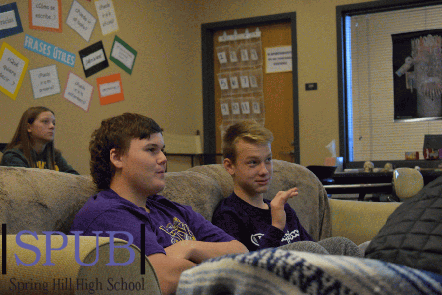 During their Advanced Spanish class, Denver Gardner and Evan Robinson, 11, talk about the different pictures that Elaine Vallejos, substitute teacher, showed. The pictures of the Day of the Dead celebration shows the class the culture of spanish speaking countries (Photo by I. Williams).