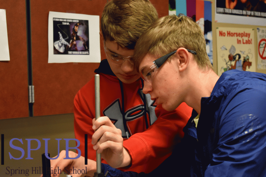The AP Chemistry teacher, Gissel McDonald, class Keen Knittle and Jordan Kinsley, 11, set up their test tube for their lab. In this lab they were tasked with determining the density of the gas through evaporation (Photo by H. Smith).
