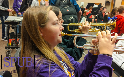 Trumpet players Emily Gehlen, 9, and Gillian King, 9, warming up before their first hour band class, on Dec. 4. They will preform with the band at their concert, Dec. 12 (Photo by R. White)
