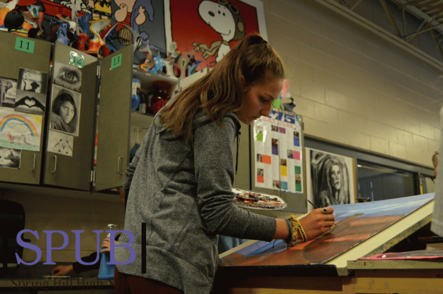 On Oct. 3, Sloane McKinney, 12, works on her painting during her seventh hour painting 2 class. McKinney adds on some of the last strokes of the brush that will make her piece complete (Photo by O. Chrisman).