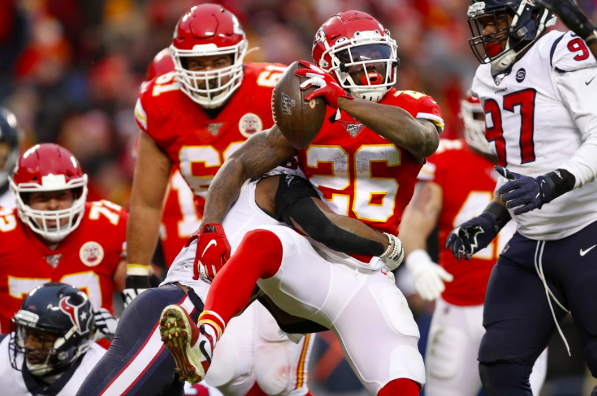 Running Back for the Kansas City Chiefs, Damion Williams, 26, runs the ball into the end zone. Williams is being held back by Justin Reid, 20, Texans safety. (Photo curtesy of AP Photo and Jeff Roberson) 