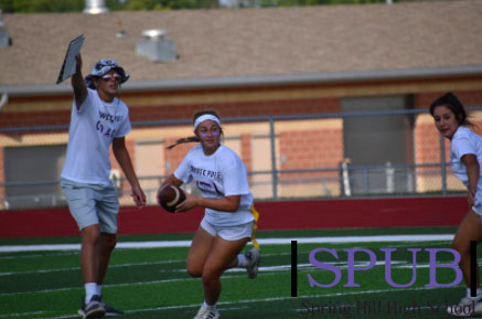 On Sept. 13, juniors Kerrigan Clooney and Kilee Castro play football and try to get a touchdown while junior Kamryn Crotchett coaches them. The juniors fought to win, but lost the game, 28-0 (Photo by H. Smith).
