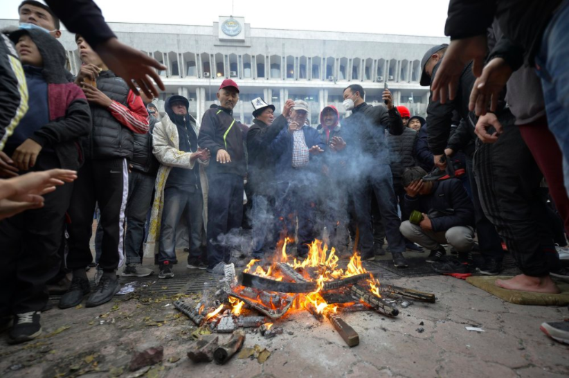 Protestors gathered in front of Kyrgyzstans governmental building to express their discontent with the election (photo credit AP News).
