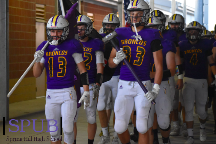 Varsity football boys get ready to run onto the field and play against the Bonner Springs Braves. Zach Knowlton, 11, and Chase Wilm, 12, were in the front with the brotherhood flag and hammer (photo credit A. Davis).
