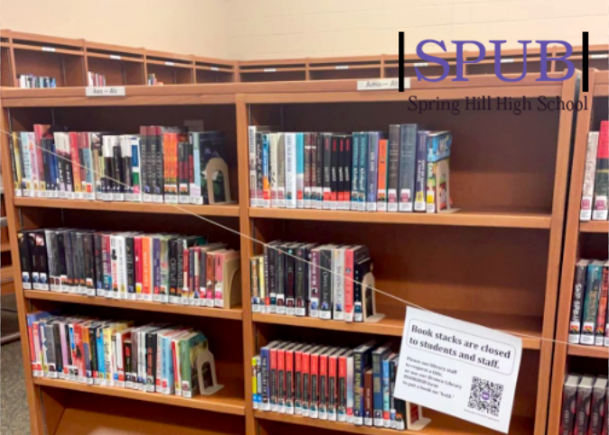 Although checking a book out this year may look different, it is still just as easy. “Book stacks are closed to students and staff” as the paper says, so you must request a book title  to the library staff or use the bookhub form to put a book on hold (photo by M. Putnam).