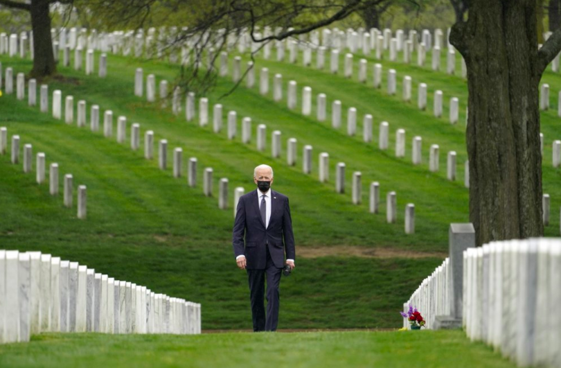 President Joe Biden walks through Arlington National Cemetery. President Biden recently announced plans to withdraw all remaining American troops from Afghanistan (photo courtesy AP News).