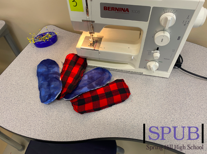 The Apparel Productions class is hard at work making washable, reusable menstrual pads for girls in Africa who do not have access to the products they need (photo credit T. Dent).