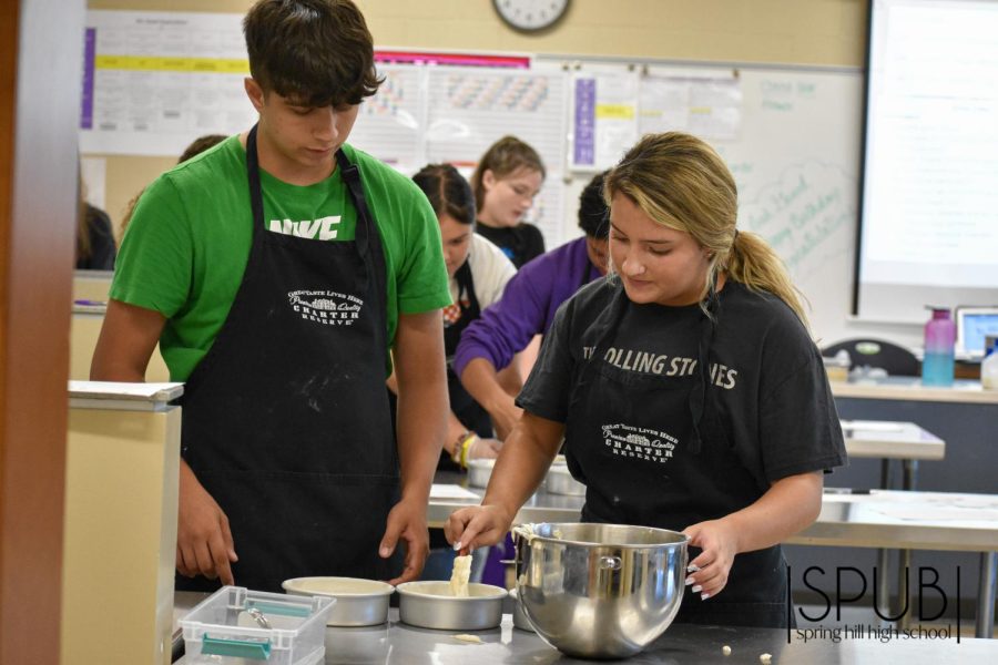 On Sept. 19, Lily Duran, 12, and Nathan Carlson, 12, mix ingredients in Leah Goods Baking and Pastry sixth hour class.
