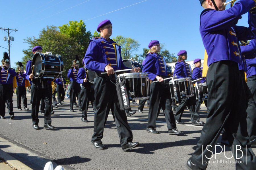 On Sept. 24, Thaddeus Rowan, 12, marches in the Fall Festival Parade in the percussion section.