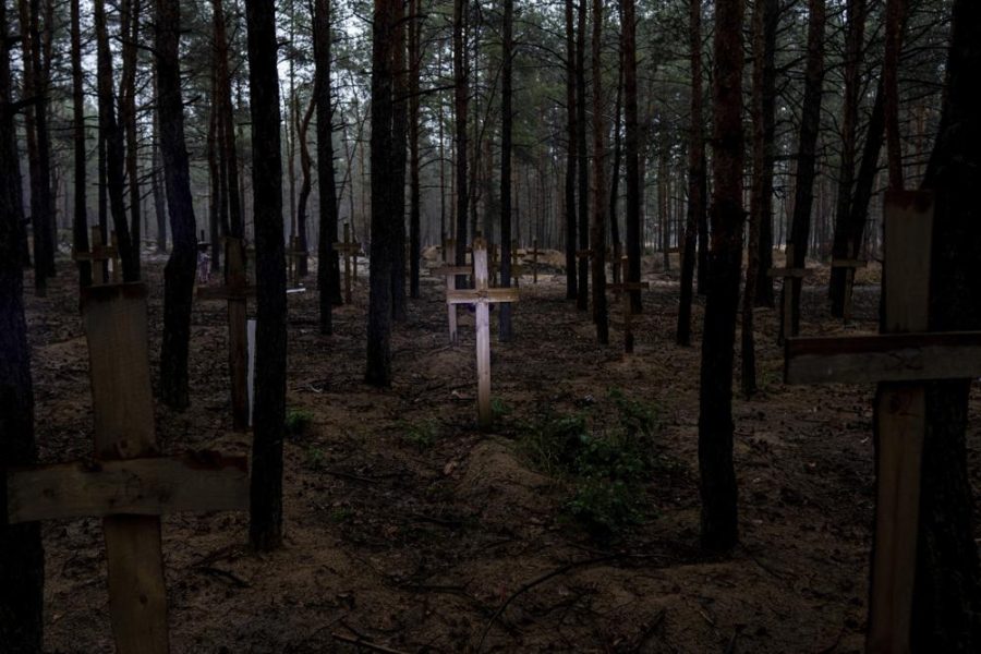 Unidentified graves are discovered in Ukraine (photo courtesy AP News).