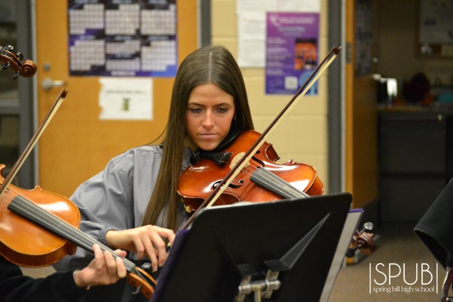 On Oct. 3, Olivia Gaa, 12, plays the violin in Nusret Ozakincis orchestra class. 