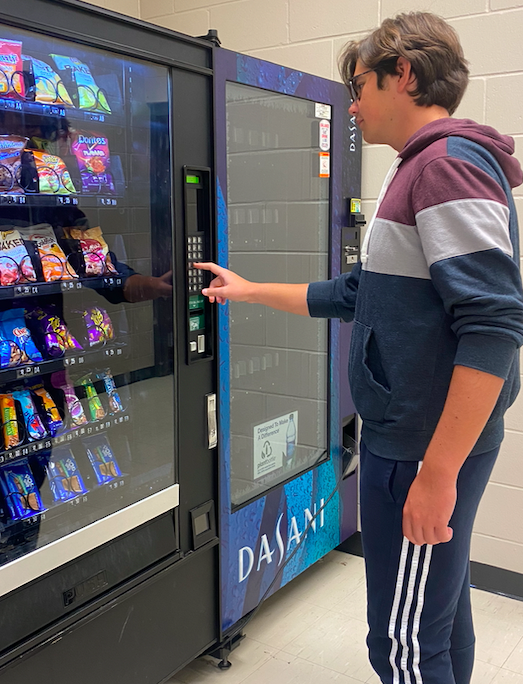Weston Whipkey, 12, uses the vending machines to get a snack (photo by S. Hatcher).