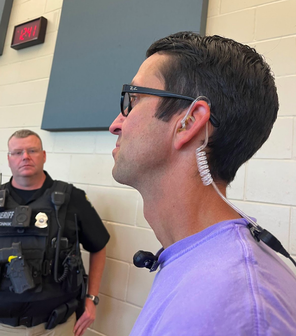 Clay Frigon, assistant principal, wears an ear piece to communicate with other faculty (photo by O. LeBlanc).