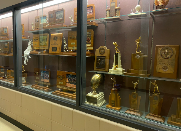 The trophy case is located outside the gym on the south side of the building. It allows for those visiting to see all the awards from the past until now (photo by H. King).