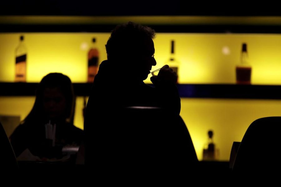 Man sips a drink at a bar in New Jersey on Nov. 3, 2017. Since then, excessive drinking has worsened (photo courtesy AP News).
