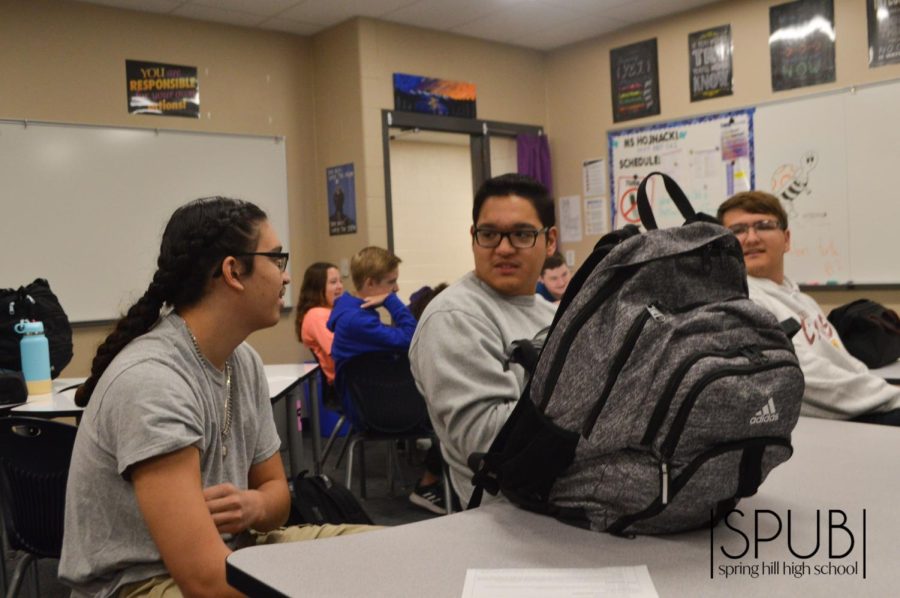 On Oct. 25, Alexandro Garcia, 10, and Adiel Garcia, 11, discuss the answer to a question at a scholars bowl practice.