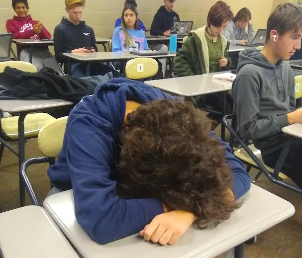 Lacking sleep, Brody Peterson, 10, takes a nap in class (photo illustration by H. King).