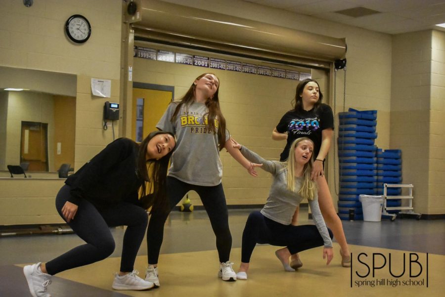 On Nov. 30, the dance team practices one of their poses in a song.