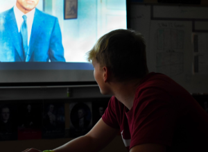 Zachary Means, 12, watches a film in class (photo by C. Holmes).