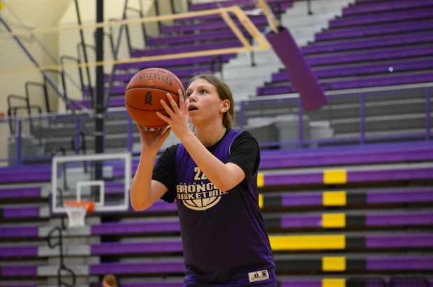 Madison Brown, 9, practices her free throws (photo by T. Elliott).