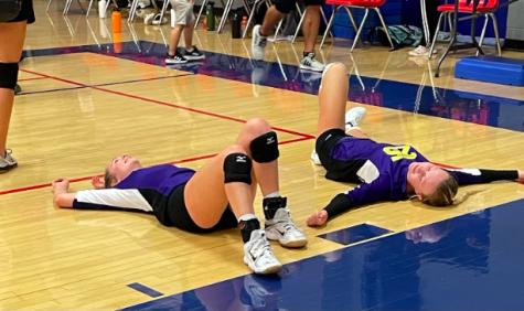 Mueller and Addelyn Horne, 10, are exhausted after their volleyball game (photo submitted by H. Mueller).