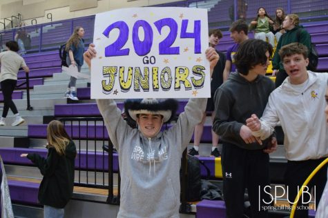 On Feb. 10, during the pep assembly, James Sheldon, 11, cheers for the juniors while holding a sign.