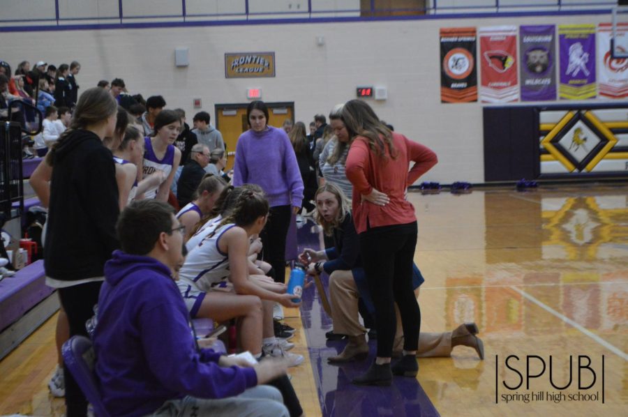 On Feb. 10, Coach Paige Husa speaks to the girls basketball team during a game giving them motivation to keep working hard.