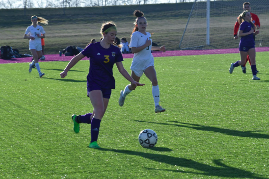 Elizabeth Williams, 10, playing on the varsity soccer team (photo by M. Brown).