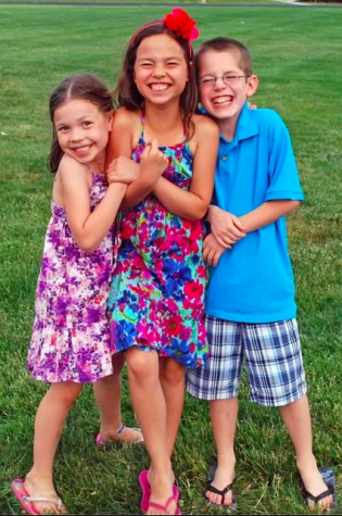 Faye Dent, 4, on the left, sister Taylor Dent, 7, and brother Mason Dent, 7, posing in a photo together (photo provided by F. Dent).