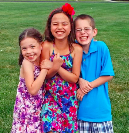 Faye Dent, 4, on the left, sister Taylor Dent, 7, and brother Mason Dent, 7, posing in a photo together (photo provided by F. Dent).