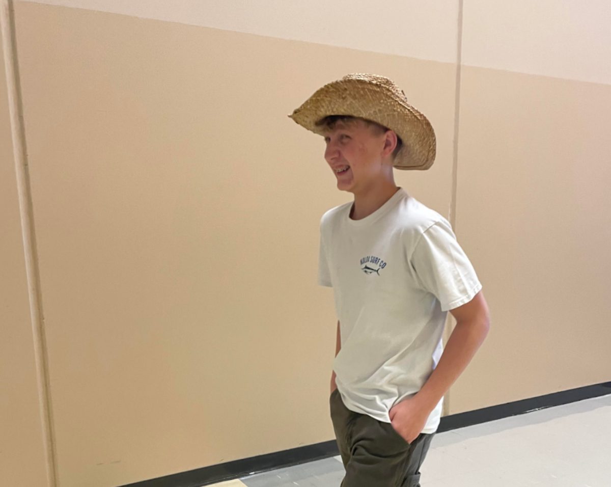 Daniel Heinen, 10, walking in the hallways wearing their hat. They are taking advantage of the new changes in the dress code policy. (Photo by M. Chaulk)
