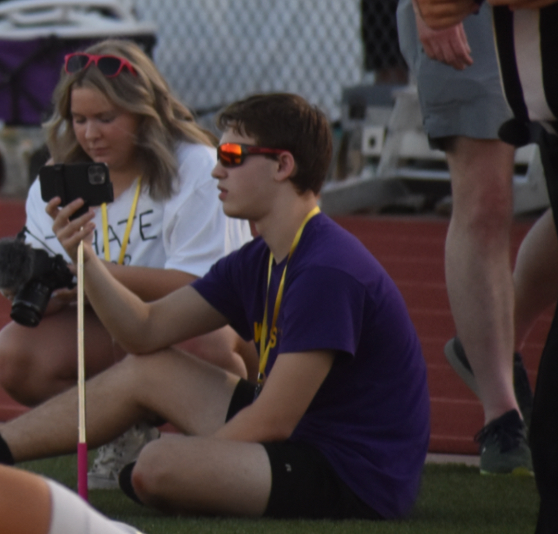 Caden Bartek, 12 and Ashlyn Watson, 12 work together while shooting a football game. Caden often meets his fellow A/V club members as they shoot games.  (Photo by M. Ceniceros) 