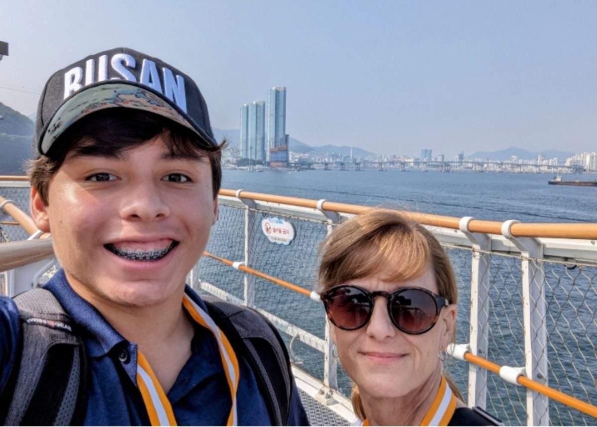 Nathan Montgomery, 11, and Jane Montgomery, mother, stand on a boat overlooking South Korea. This is one of many activities Montogmery participated in while on their South Korea trip (Photo by N. Montgomery). 