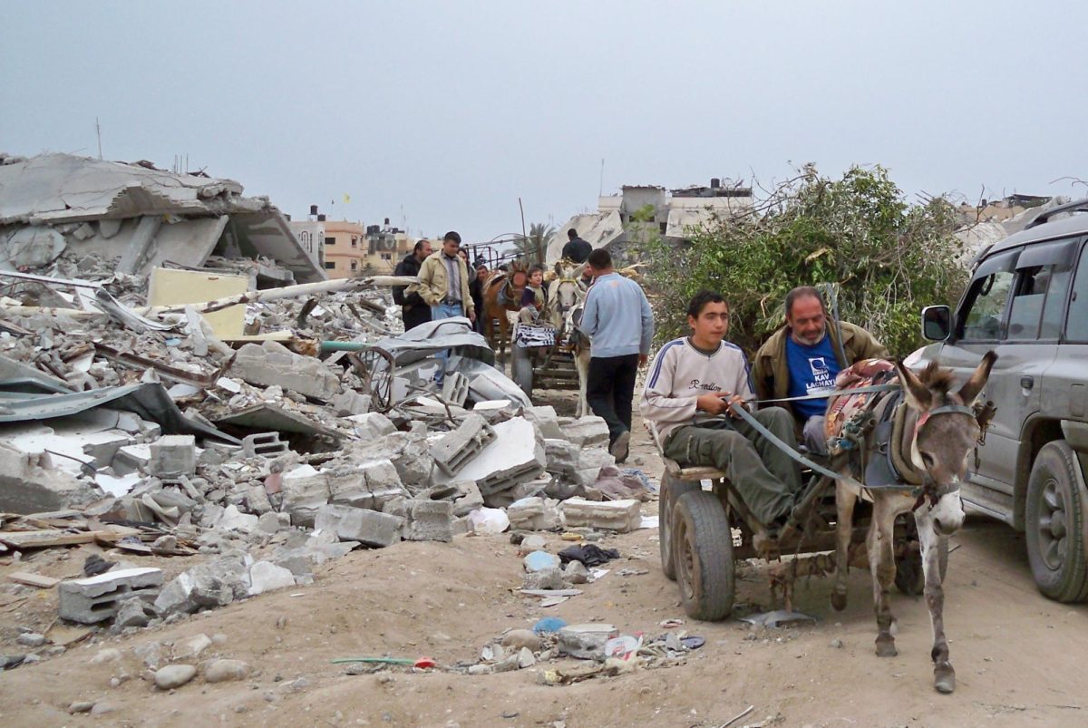 Citizens of Gaza take in the destruction around them. This is the first of what could many many attacks (Photo by D. Mohigan). 
