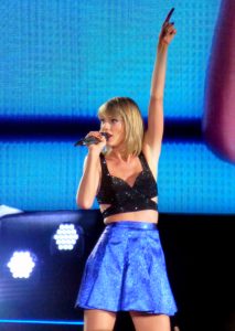 Taylor Swift posing on her 1989 tour. This was from the first 1989 era in 2015. (Photo by Wikimedia Commons). 