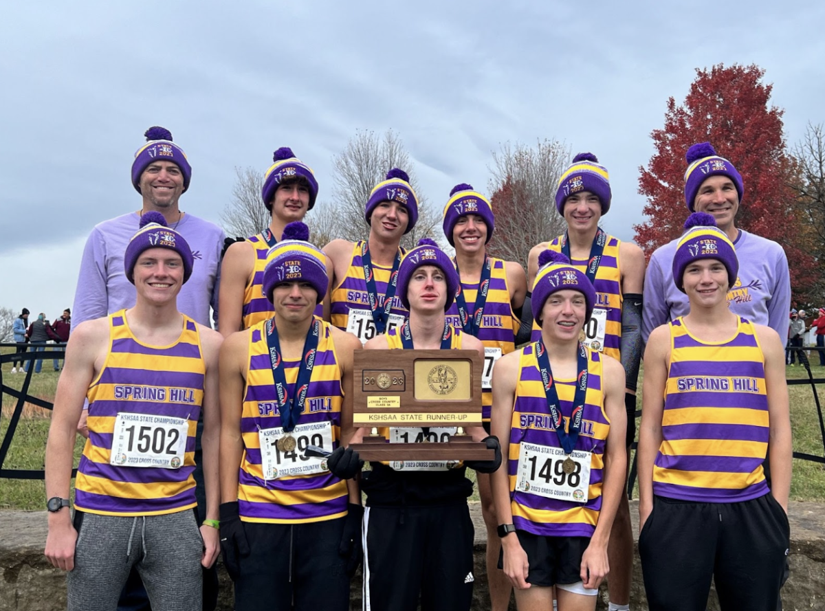 The varsity boys pose with the second place plaque at their 5A state meet. This is the first time in school history the boy’s team has earned second place. (Photo by K. George)