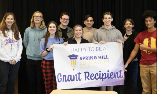 Pictured is the Video Productions class receiving the grant banner. They are thrilled to have received this grant. (Photo courtesy of the Spring Hill Schools Facebook).