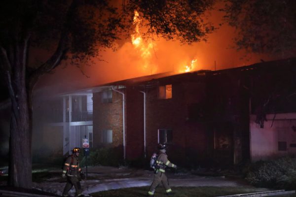 Two firefighters attempt to put out a blazing fire. This photo shows the danger a fire can cause and why Firemen are important for the community. (M. Frizzell)