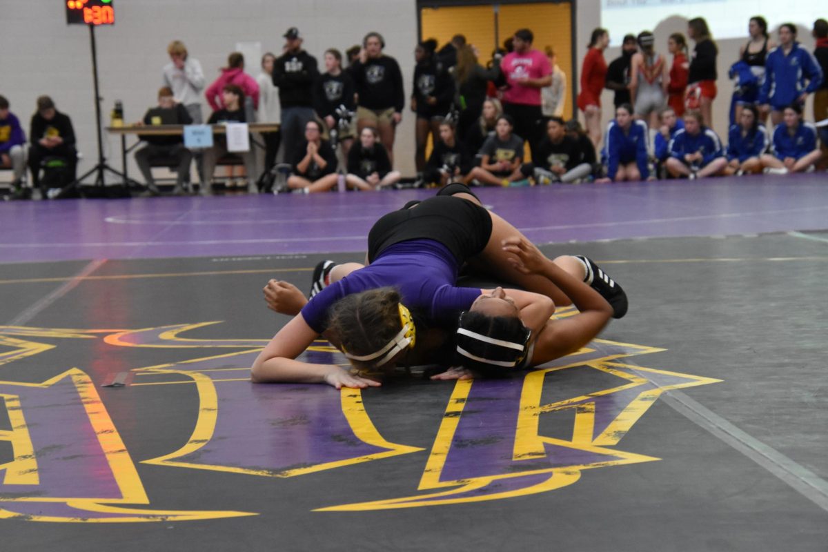On Dec. 2, Madison Veal, 11, attempted to pin their opponent on Bronco territory. 