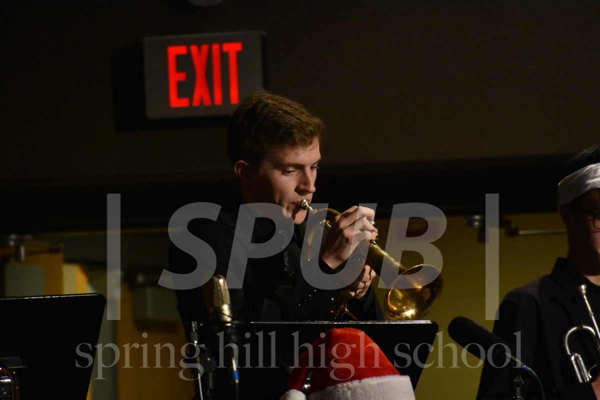 Chase Bond, 12, performs during the winter band concert on Dec 11. Bond plays the trumpet in both jazz band and concert band.