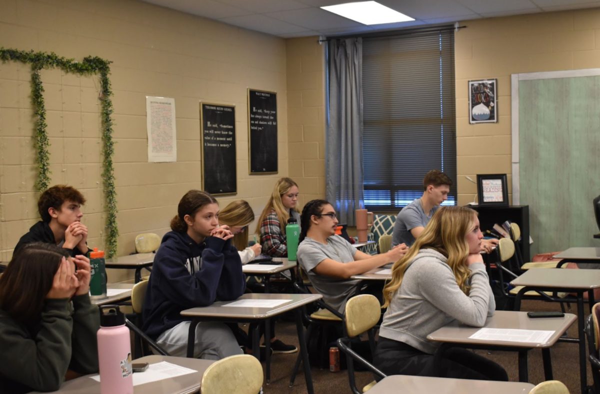 Students sitting and learning in AP Lang. AP Lang helps prepare students for actual English college classes (Photo by H. Evans).