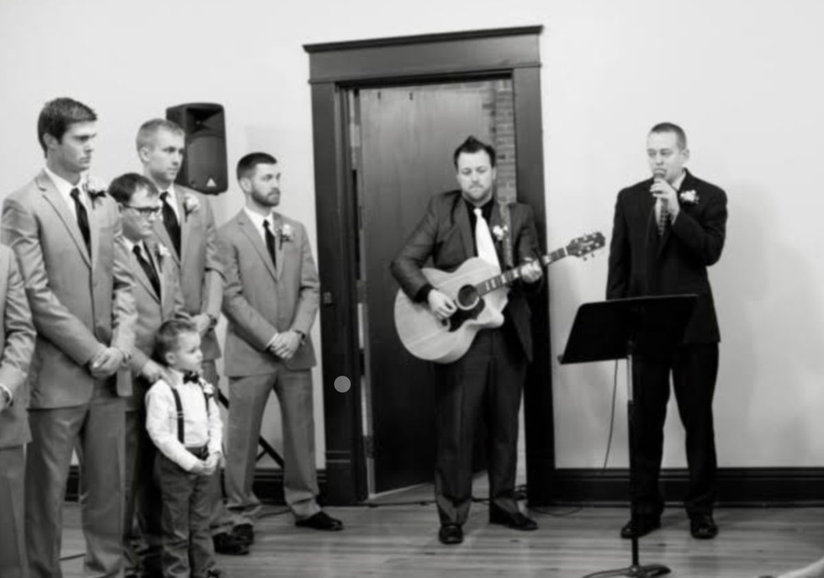 Bechard singing at Jamie Oshel’s, gym teacher, wedding. They sang an Ed Sheeran song for both songs (Photo submitted by C. Bechard). 