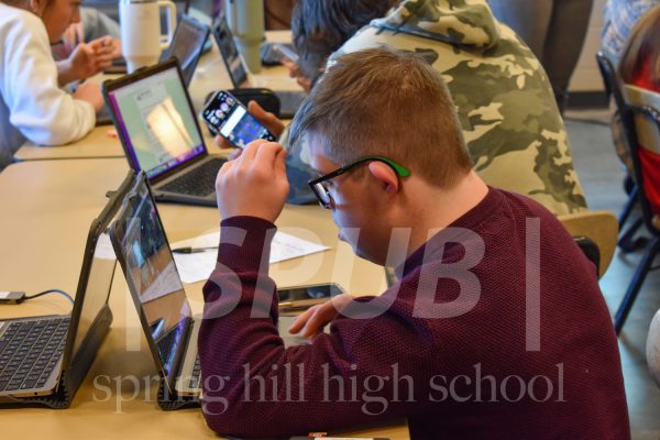 Eagan Boren, 10, works on their photo imaging project during fifth hour in Anna Manning’s class. 