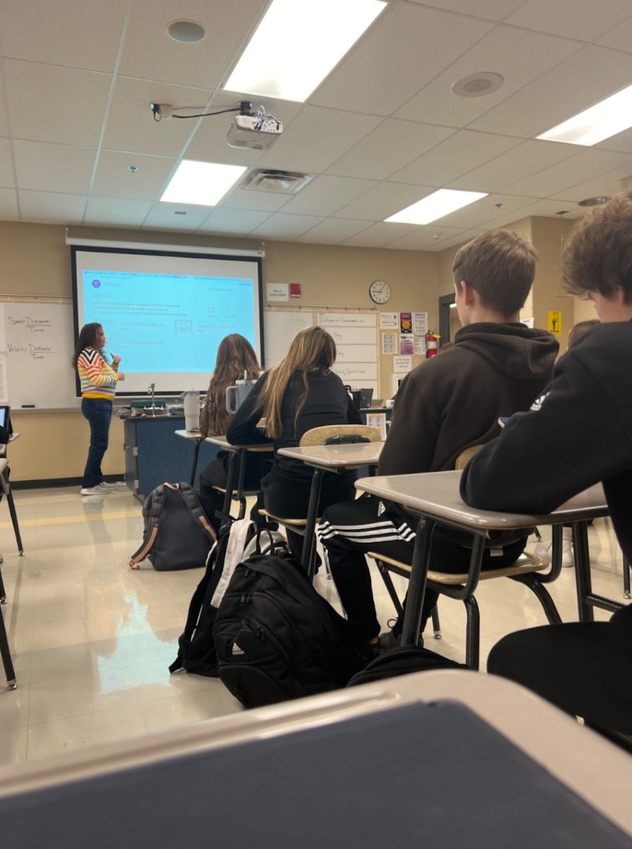 Torrez explained to their students the new science assignment. Students are focused and ready to learn (Photo by Ella Crabtree).