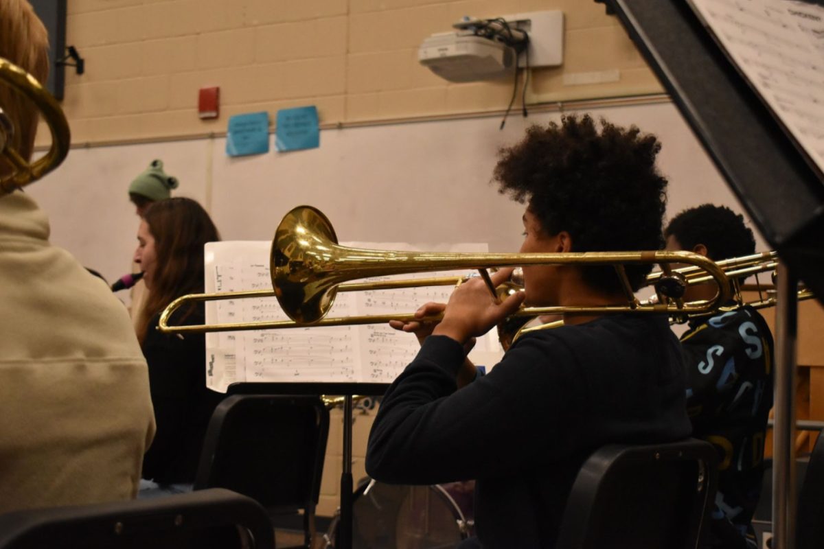 Jadon Kadera-Redmond, 12, practicing in Jazz Band. They play the trombone (Photo by O.Tarvin). 